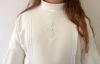 Picture of Elegant First Communion tunic for girls with fan sleeve, trim and central cross with strass.